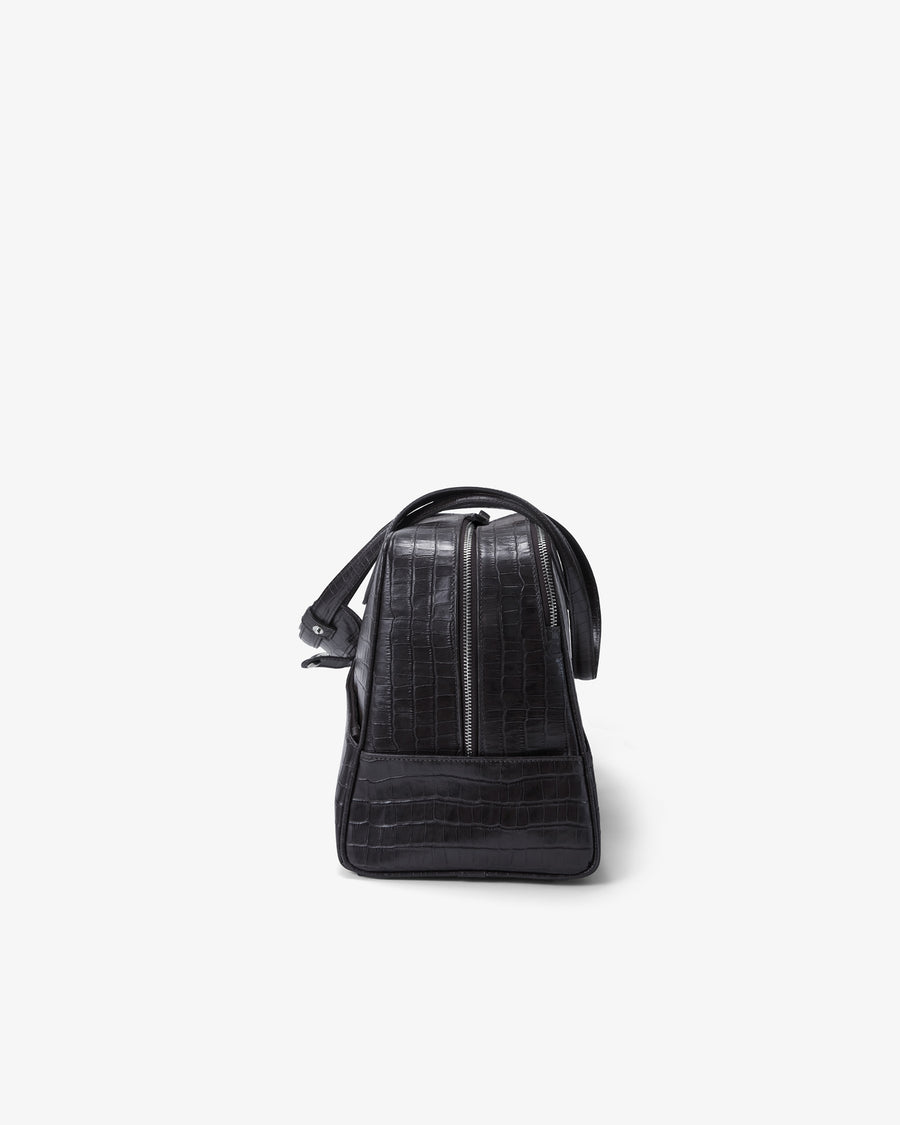 A black crocodile-embossed leather bag shown from the back against a plain white background.