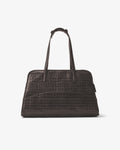 A dark brown crocodile-embossed leather handbag with dual top handles, and a luggage strap, shown from the back against a plain light gray background.
