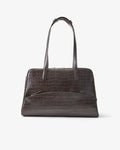 A dark brown crocodile-embossed leather handbag with double top handles, shown against a plain light gray background.