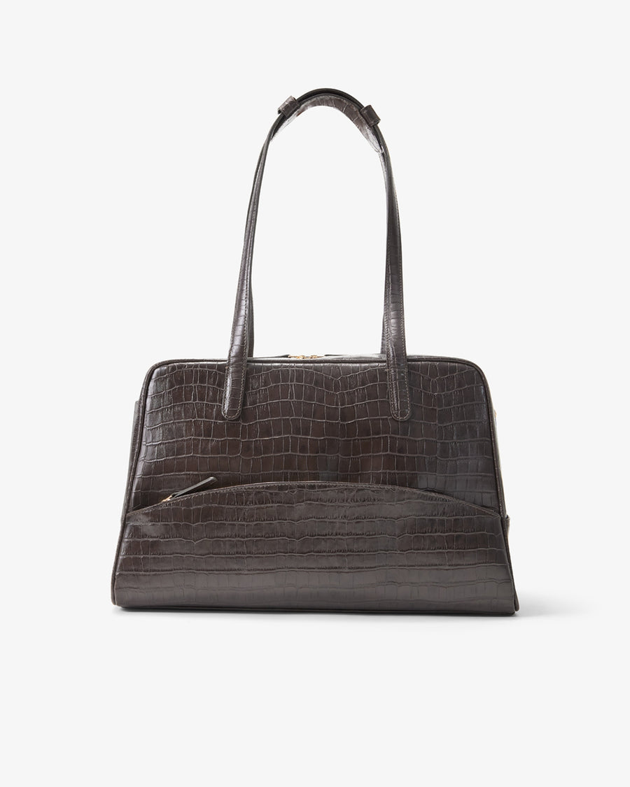 A dark brown crocodile-embossed leather handbag with double top handles, shown against a plain light gray background.
