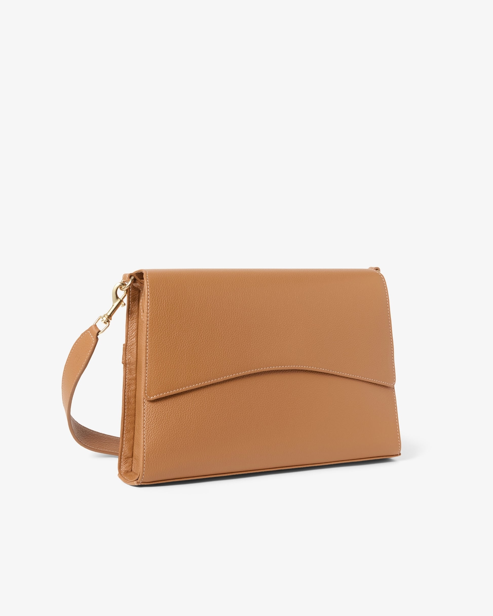 A tan leather shoulder bag with a curved flap and a matching shoulder strap, shown on a plain light gray background.