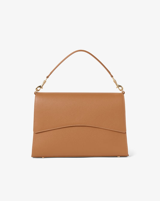 A tan leather shoulder bag with a top handle and gold-tone hardware, shown against a plain white background.