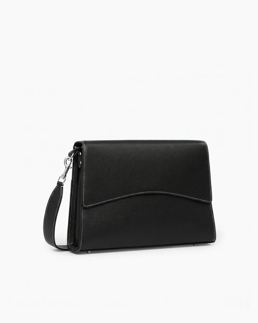 A black leather clutch handbag with a curved flap, a detachable shoulder strap, and contrast stitching, shown on a plain white background.
