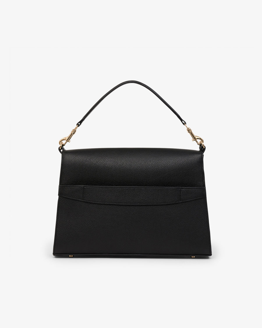 A structured black leather handbag with a top handle, gold-tone hardware, and a luggage strap shown against a plain light gray background.