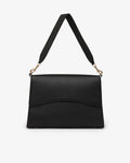 A black textured leather shoulder bag with a wide adjustable strap and gold-tone hardware, shown against a plain white background.