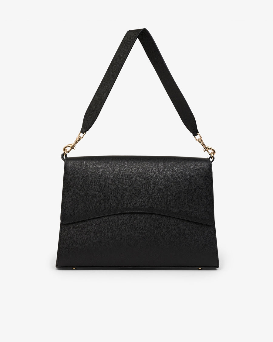 A black textured leather shoulder bag with a wide adjustable strap and gold-tone hardware, shown against a plain white background.