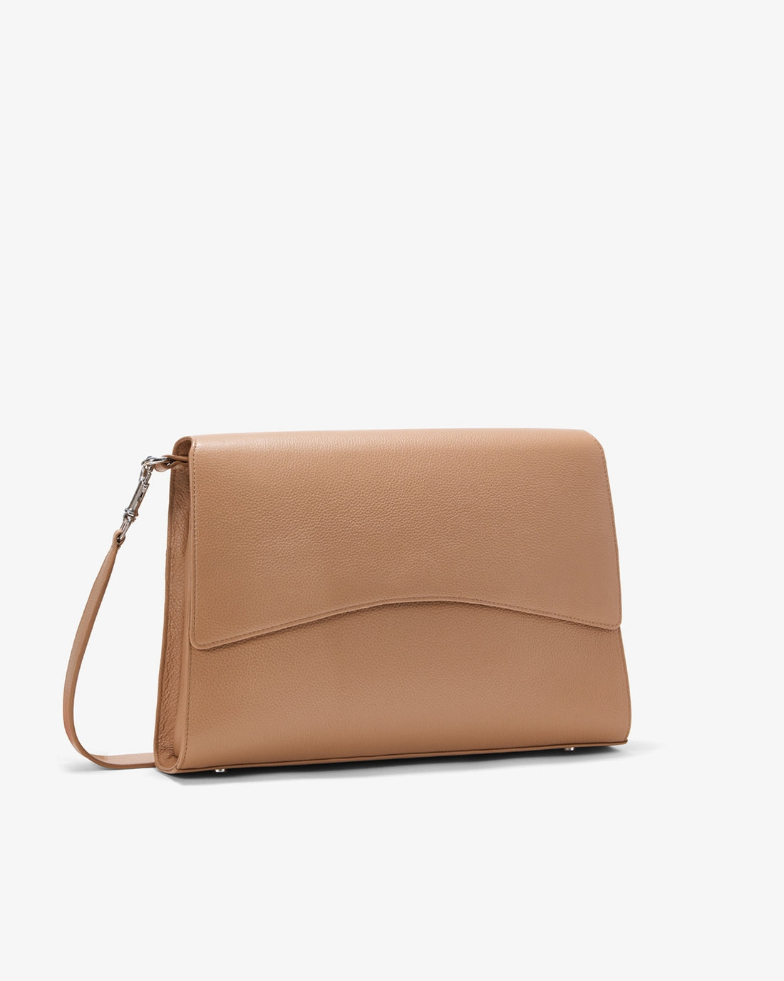 A tan leather bag with a curved flap and a matching strap, shown from a three-quarter angle on a light gray background.