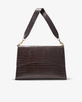 A dark brown crocodile-embossed leather shoulder bag with a matching wide strap and gold-tone hardware, shown against a plain light gray background.