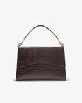 A dark brown crocodile-embossed leather handbag with a top handle and gold-tone hardware, shown against a plain white background.