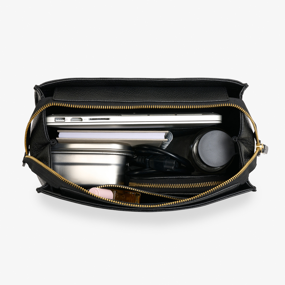 City Backpack in black/gold with curved top flap and elegant gold hardware – timeless backpack for work and beyond.