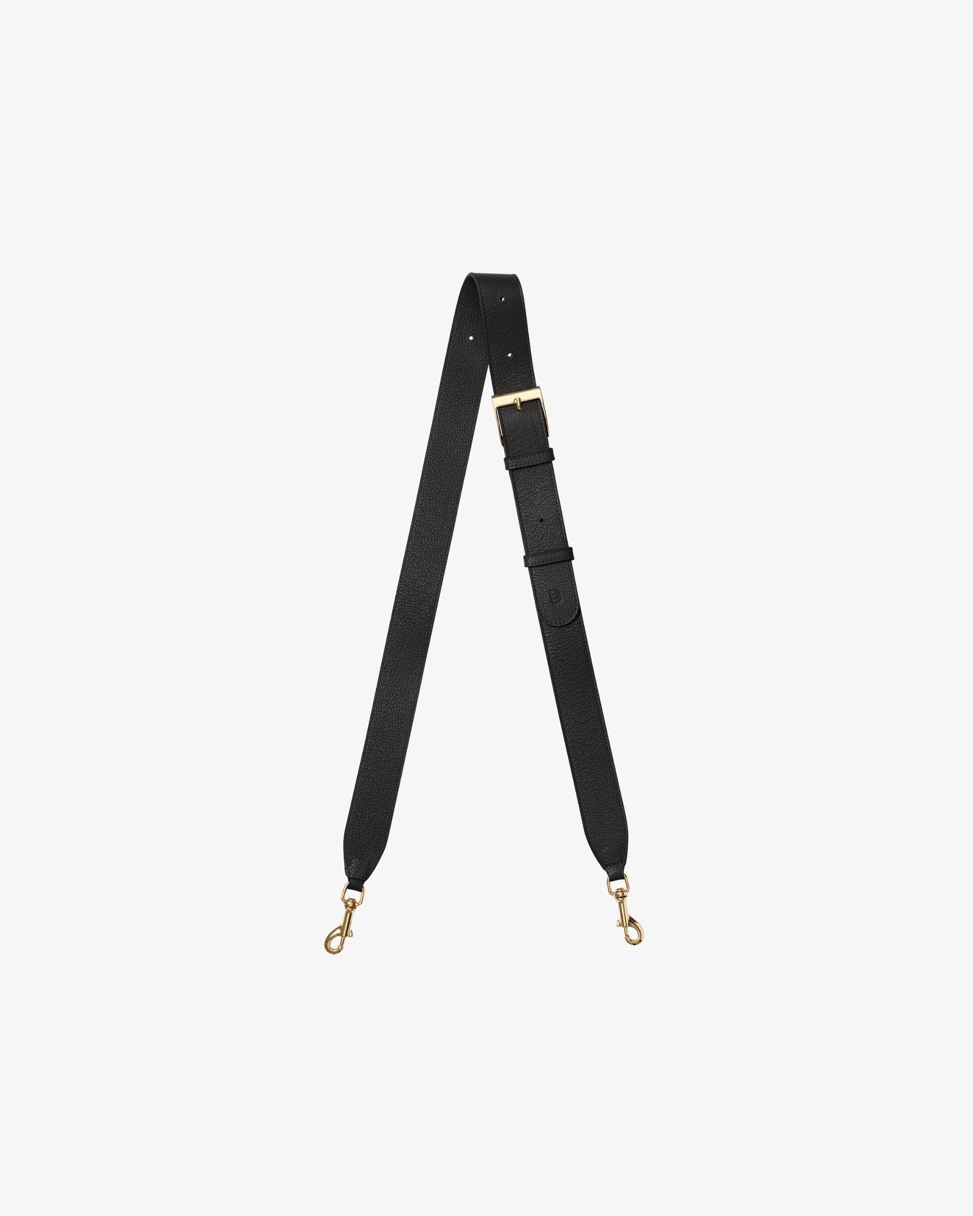 A dark brown leather cross body strap with gold-tone metal hardware, including a buckle, adjustment loops, and two swivel snap hooks, displayed on a light gray background.