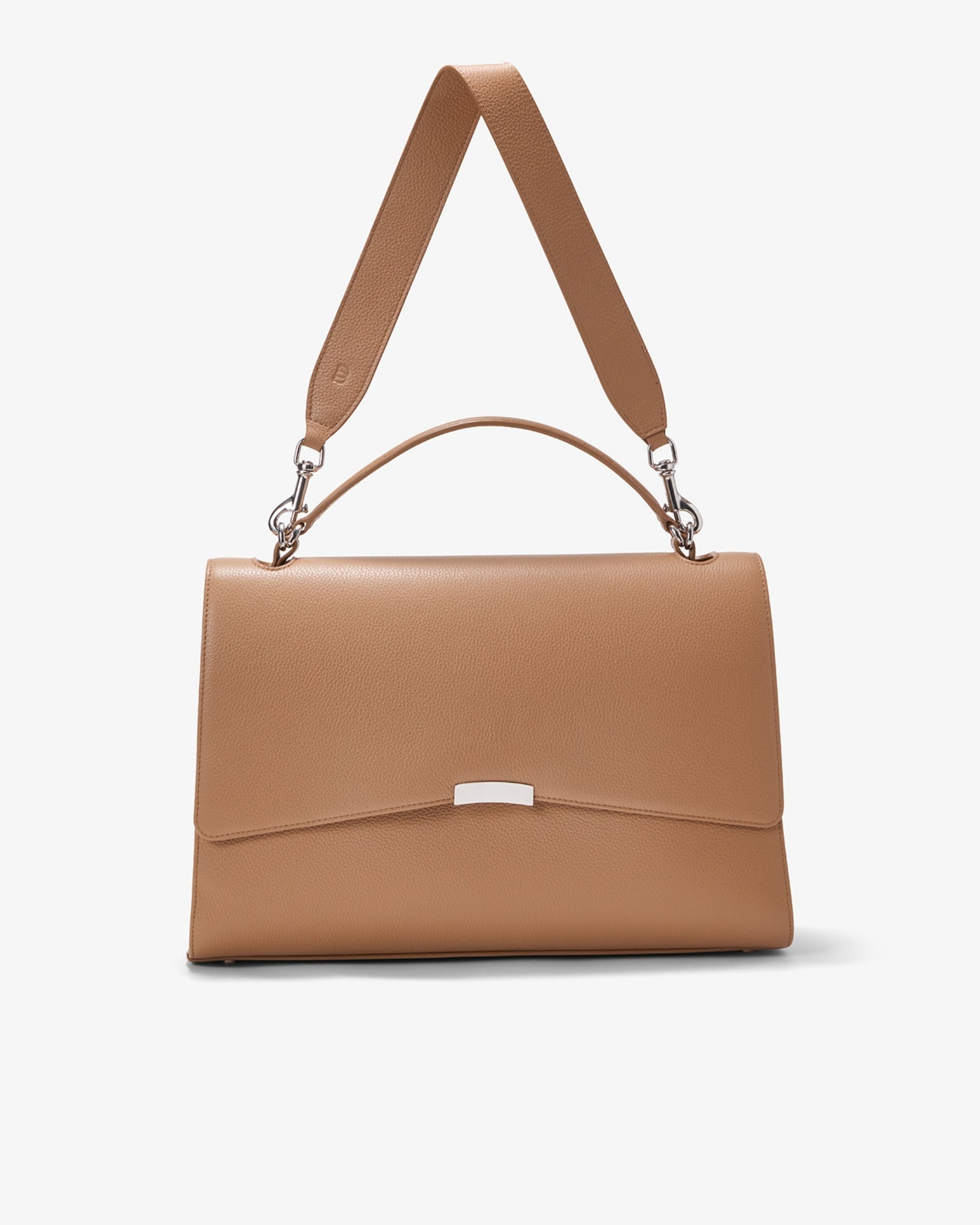 A structured tan leather handbag with a top handle, a detachable shoulder strap, and a silver-tone metal accent on the front flap, shown against a plain light gray background.