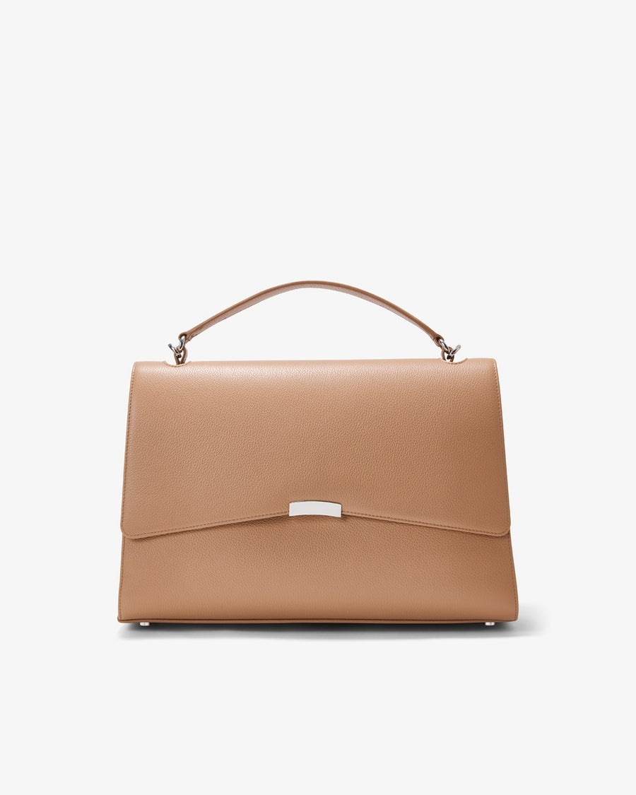 A structured top-handle handbag in tan leather with a silver-tone metal accent on the front flap, shown against a plain white background.