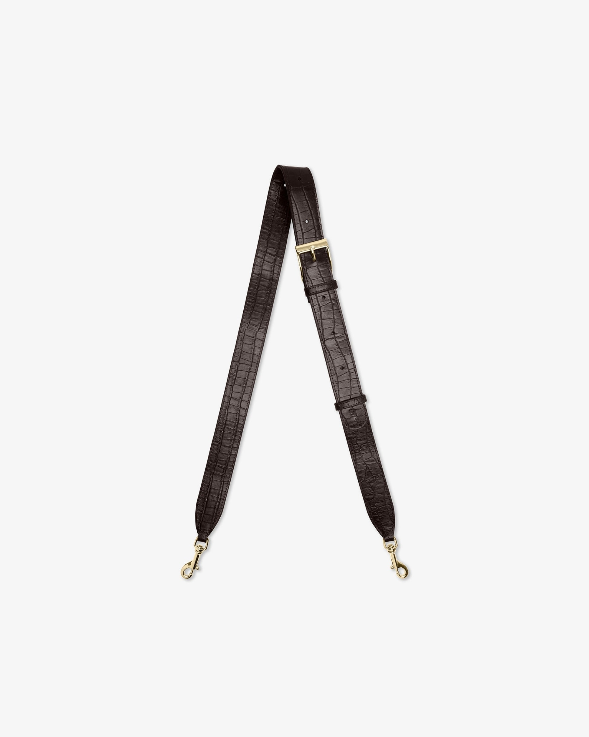 A dark brown crocodile-embossed shoulder strap with gold-tone hardware, displayed vertically against a light gray background.