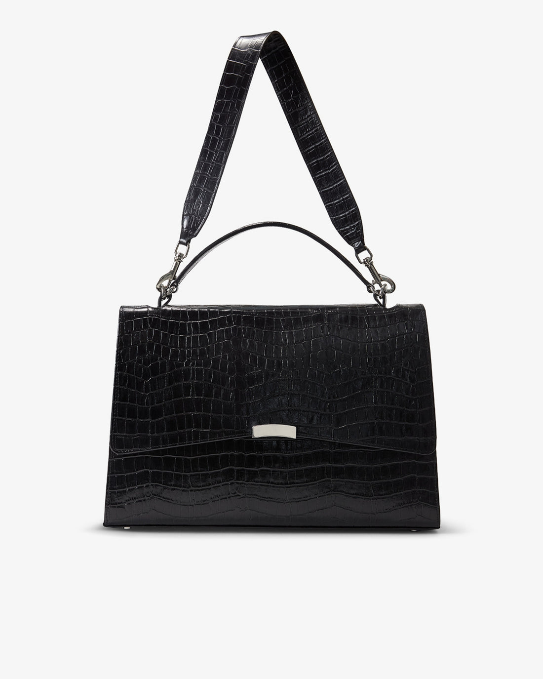 A black crocodile-embossed leather handbag with a top handle and shoulder strap, featuring a small silver metal accent on the front, set against a plain light gray background.
