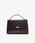 A dark brown crocodile-embossed leather handbag with a top handle and a gold-tone clasp, shown against a plain white background.