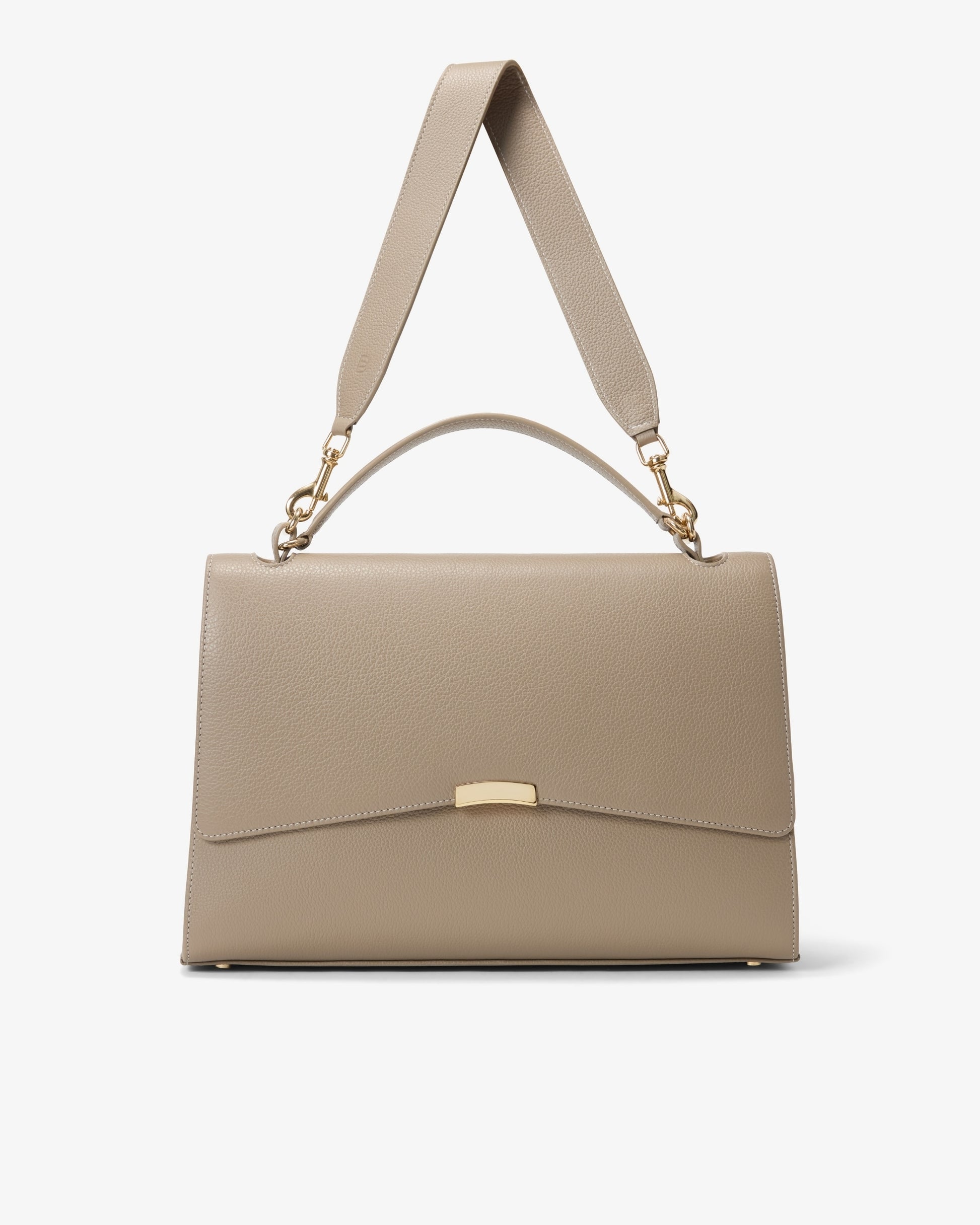 A structured taupe leather handbag with a top handle, an adjustable shoulder strap, and gold-tone hardware, shown against a plain light gray background.