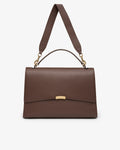 A structured brown leather handbag with a top handle, a shoulder strap, and a gold-tone clasp on a light gray background.