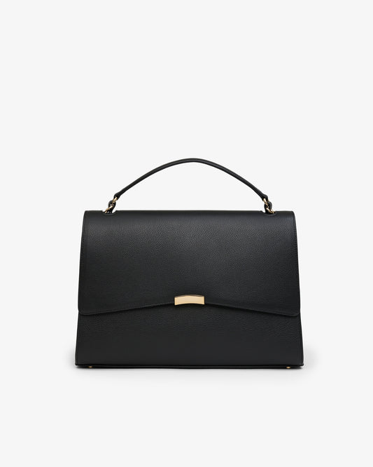 A black leather shoulder bag with a curved flap and gold-tone hardware, shown against a plain white background.