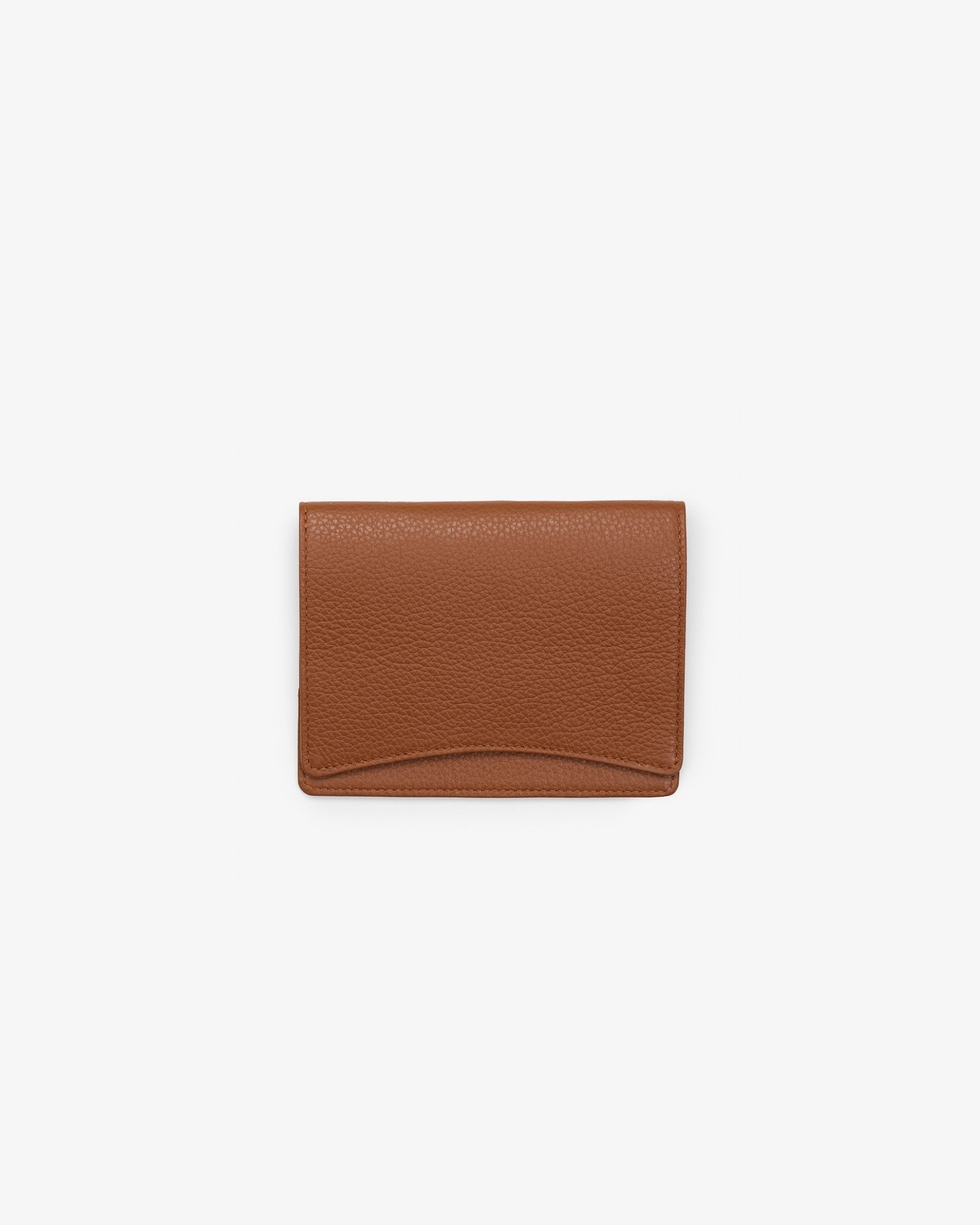 A tan leather passport holder, shown against a white background. 