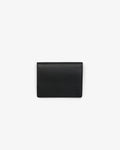 A black leather passport holder with an embossed 