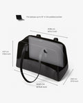 Black laptop bag with a carrying strap, shown with dimension labels and text noting it fits laptops up to 16 inches. The stand holds a translucent tablet mockup and is photographed on a light gray background.