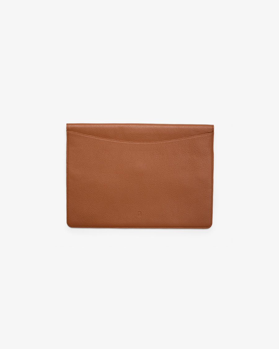 A tan leather envelope-style laptop holder, with a subtle pebbled texture and a embossed "B" logo, shown flat from the back against a solid white background.