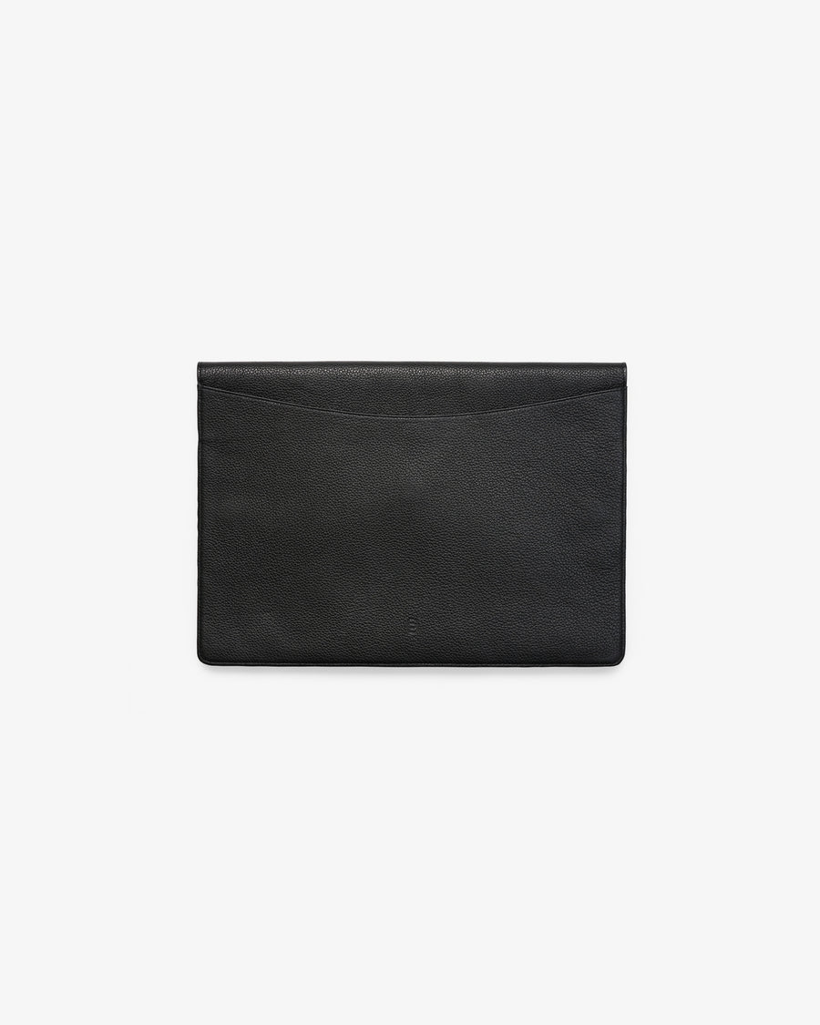 A minimalist black leather envelope-style laptop case with a subtle textured finish and an embossed "B" logo, photographed flat from the back against a clean white background.