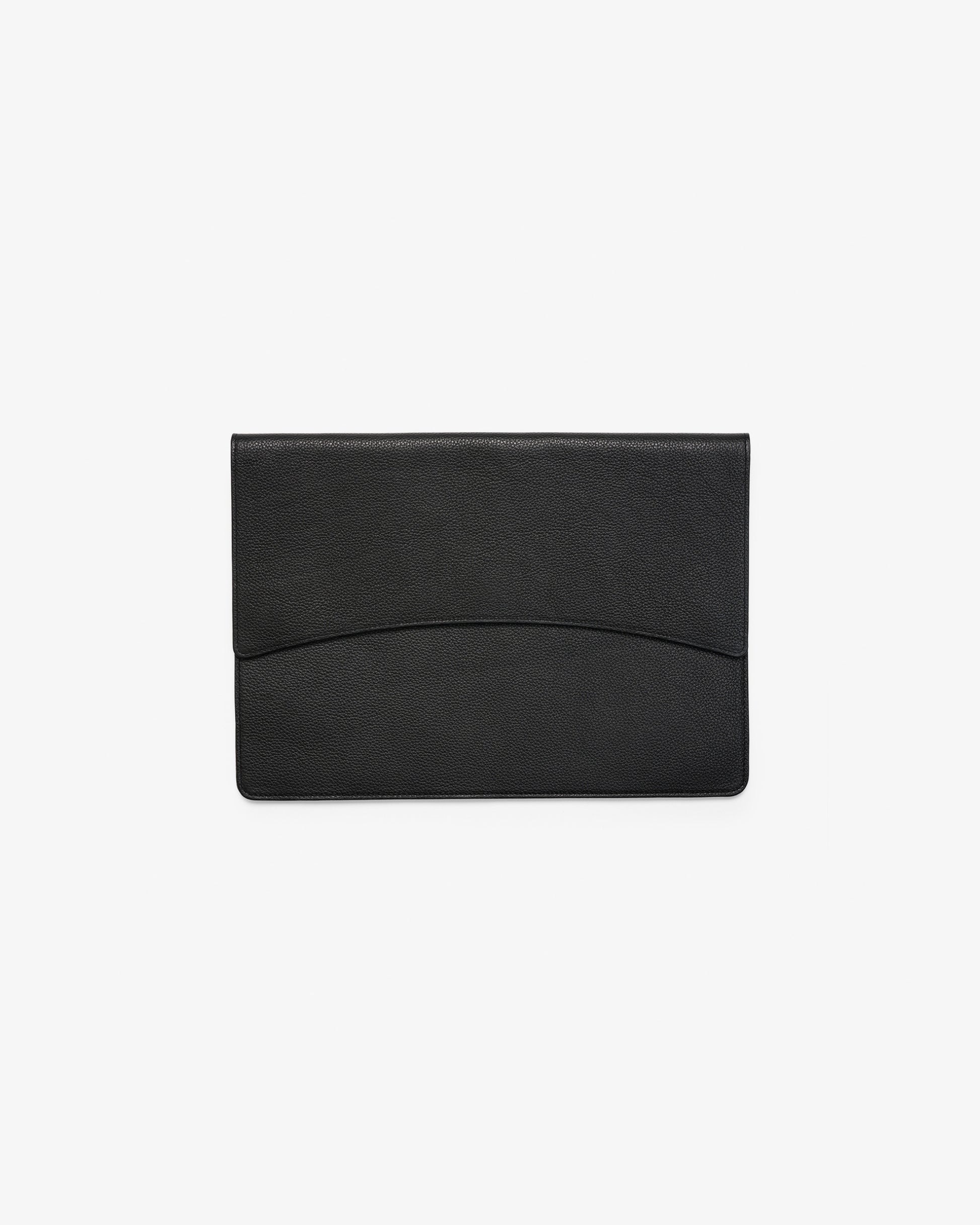 A black leather envelope-style laptop case with a subtle curved line detail across the front, shown against a plain white background.