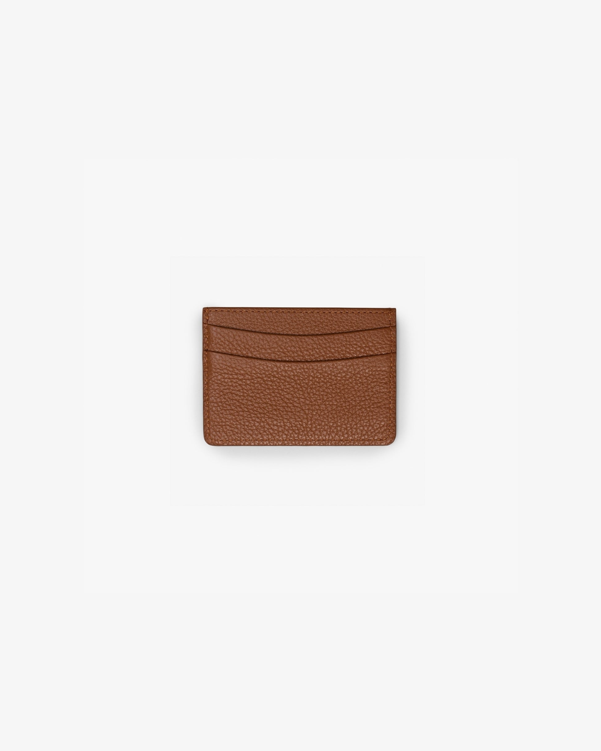 A small brown textured leather card holder wallet with curved card slots, centered on a plain white background.