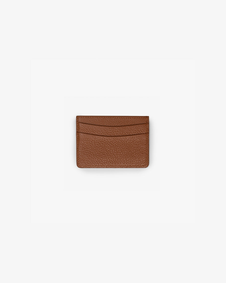 A small brown textured leather card holder wallet with curved card slots, centered on a plain white background.