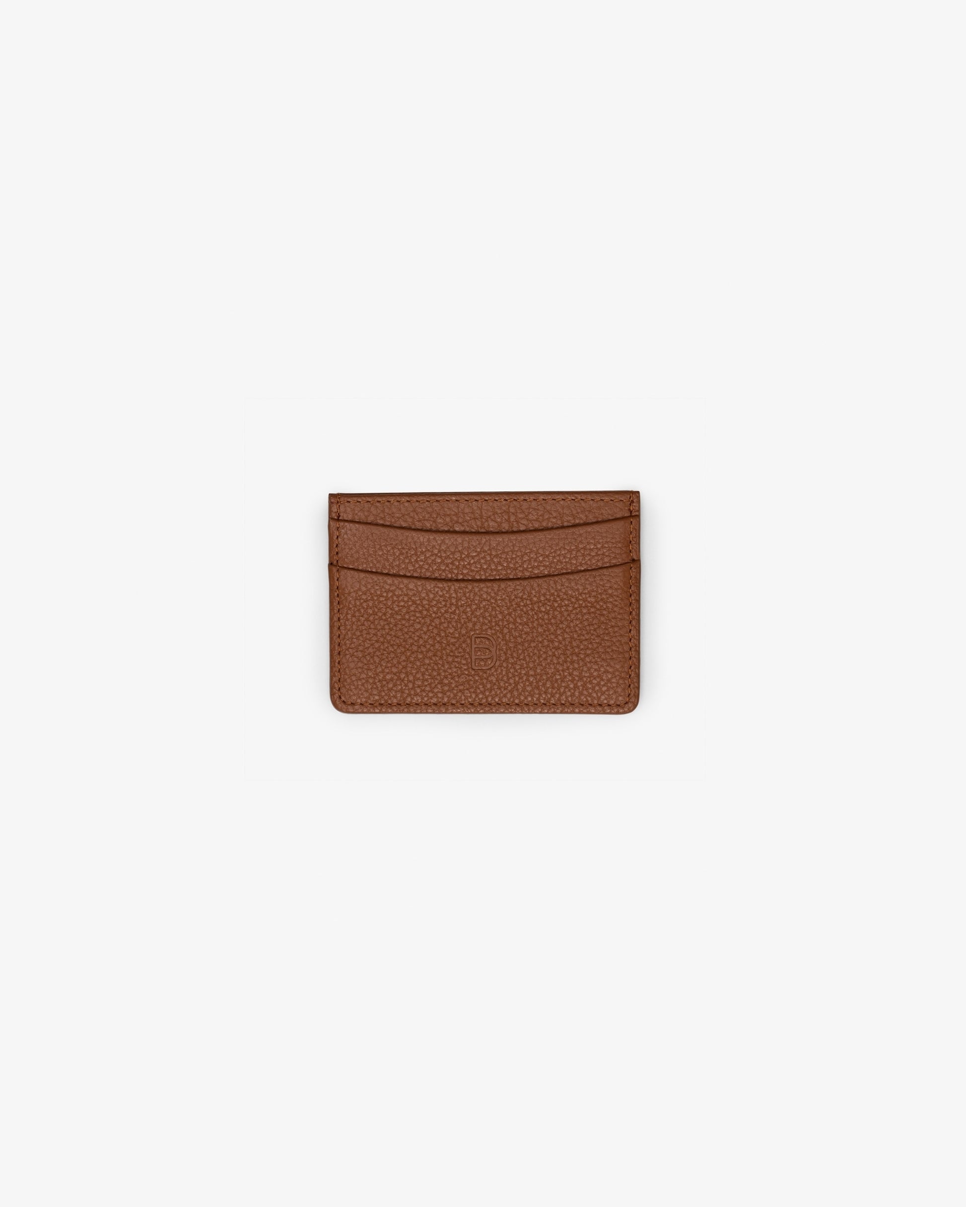 A tan leather card holder, with two horizontal pockets, shown against a white background.