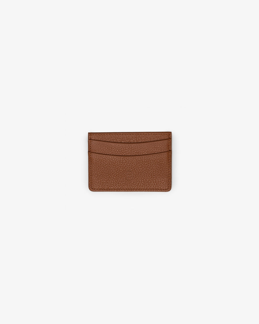 A tan leather card holder, with two horizontal pockets, shown against a white background.
