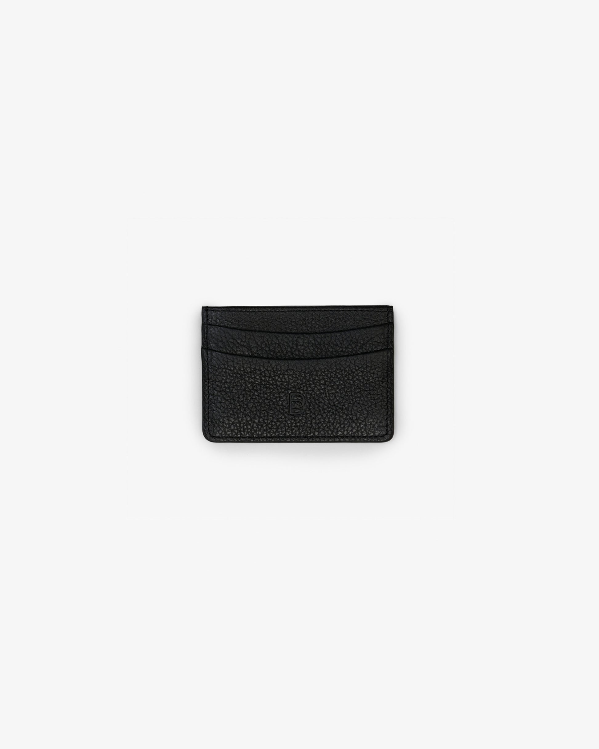 A black textured leather card holder with a subtle pebbled grain finish and an embossed "B" logo, shown from the front on a clean, light gray background.