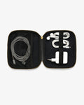 An open black zippered accessory organizer case with gold-tone zippers, shown on a light gray background. Inside, a gray braided charging cable is stored in a mesh pocket on the left, and a white earbud cable with a white charging adapter is secured by a black elastic band on the right.