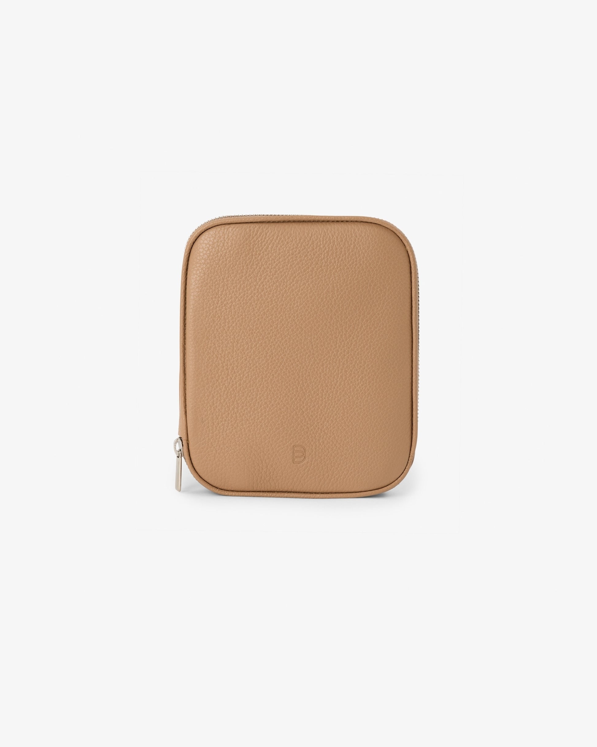 A tan pebbled leather travel pouch with rounded corners and a small embossed logo near the bottom center, shown on a clean white background.