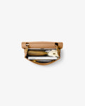 A top-down view of a tan leather briefcase bag with gold-tone hardware, shown open with a laptop and accessories inside, set against a plain light gray background.