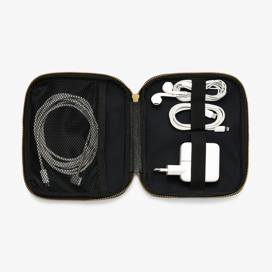 Pebbled leather cable pocket in burgundy with gold zipper – compact tech case for organized travel.