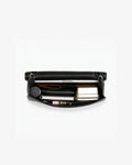 An open leather briefcase in black with white contrast stitching, showcasing items inside the bag. 