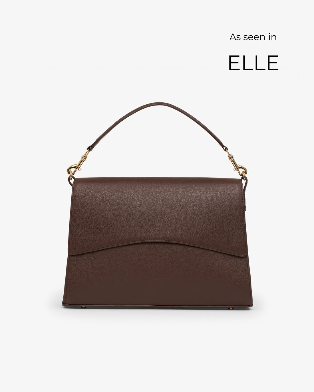 A dark brown leather handbag with a top handle and gold-tone hardware, shown against a light gray background with 'As seen in ELLE' text in the upper right.