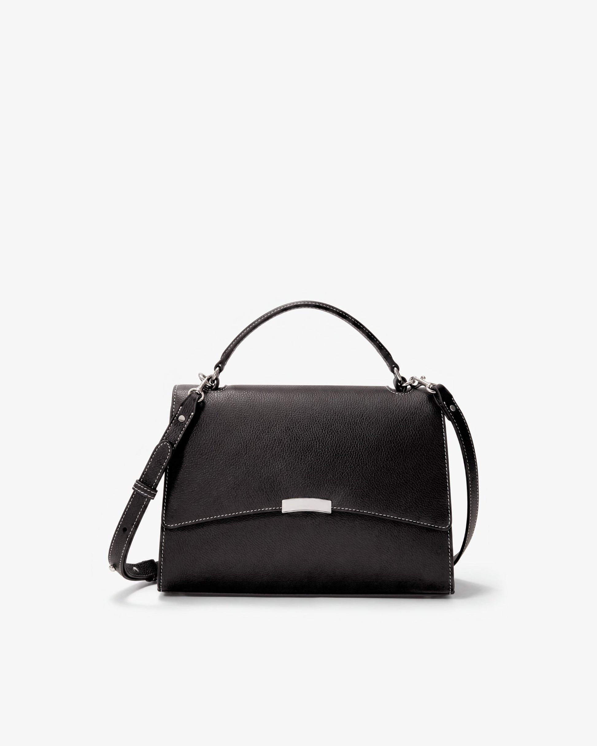 A black leather top-handle handbag with a long shoulder strap and a silver-tone metal accent on the front flap, shown against a plain white background.