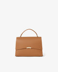 A structured tan leather handbag with a top handle and a gold-tone metal clasp on the front flap, photographed against a clean white background.