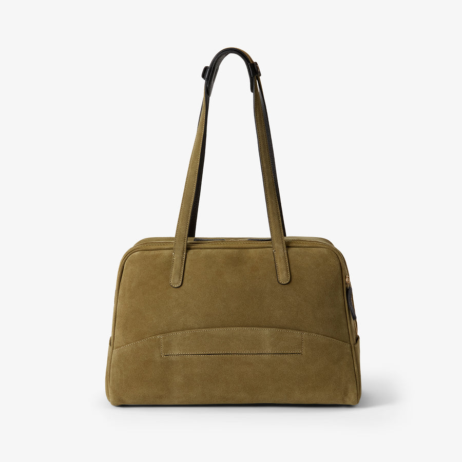 Back view of the 12 Hour Duffel Bag in Olive/Gold, featuring a discreet luggage sleeve for effortless travel compatibility and a smooth suede finish.