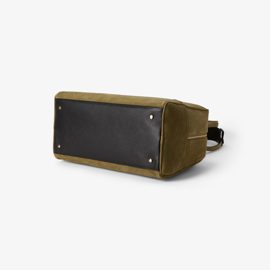 Bottom view of the 12 Hour Duffel Bag in Olive/Gold, showcasing the reinforced leather base with gold-tone protective feet for added durability and structure.