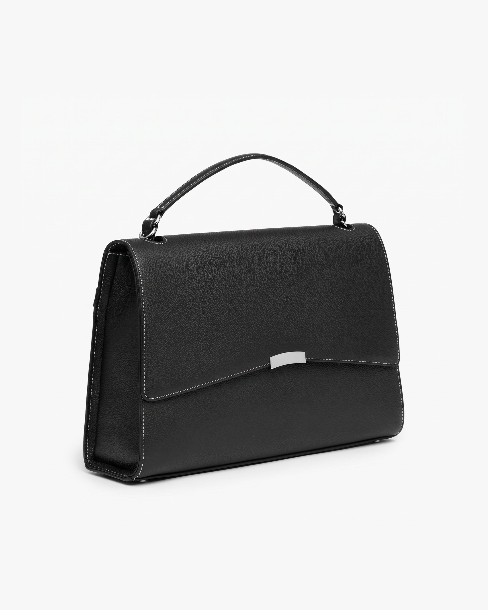 A black leather top-handle handbag with a silver-tone metal accent on the front flap and contrast stitched seams, shown from a three-quarters angle against a plain white background.