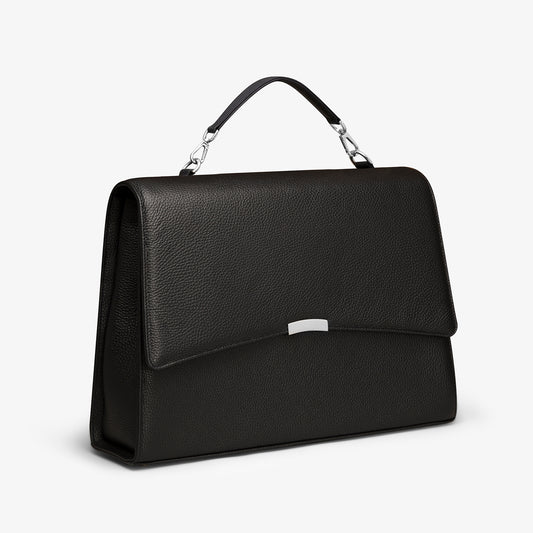 A black laptop bag in grained leather with silver metalware. It has a detachable top handle and a detachable shoulder strap. The bag fits your laptop and other daily essentials. 