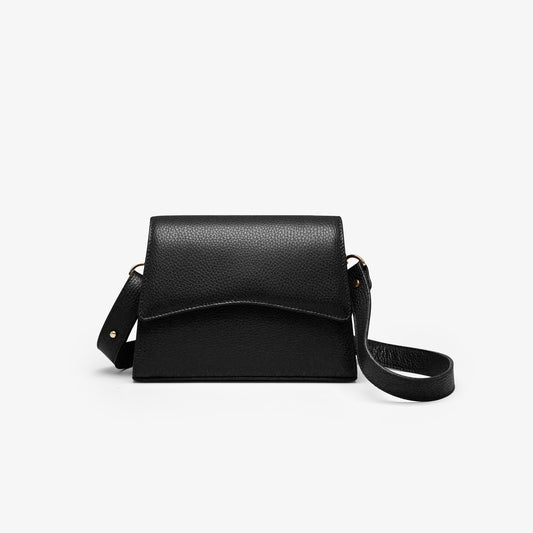 A black grained leather handbag with light gold metalware and an adjustable strap for a comfortable crossbody or shoulder fit. 